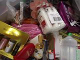 a close up of a box full of cosmetics and other items