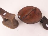 pair of antique wooden bells and a cast iron bell on a white background