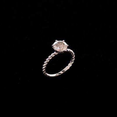 a close up of a diamond ring on a black background