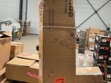many boxes stacked on top of each other in a warehouse