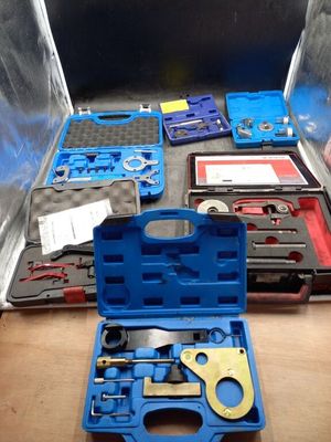 a blue tool case with tools in it on a table