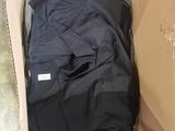 a box with a black shirt in it on the floor