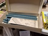 a box with a book inside of it sitting on a table