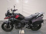 a picture of a motorcycle that is parked on a checkered floor