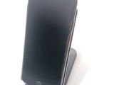 a cell phone that is sitting on top of a stand