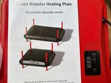 a box with two red heating plates on it