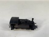 a small toy train sitting on a white surface