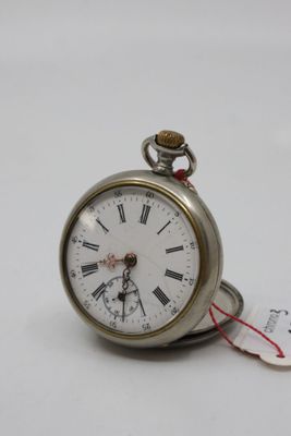 a silver pocket watch with roman numerals on it