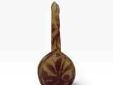 vase en verre brun orné d'un motif de feuilles sur le dessus