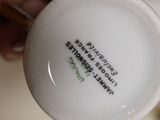 a person holding a cup with a quote on it