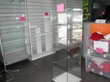 a glass display case in the middle of a store