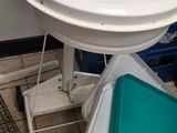 a white table with a green tray on it