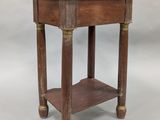 a small wooden table with a shelf on top of it