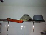 a shelf that has a hat on top of it