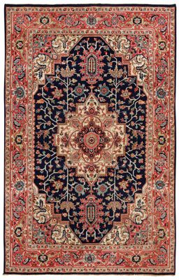 un tapis bleu et rouge à motifs de médaillons
