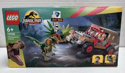 the box is open to show the contents of the lego jurassic park set