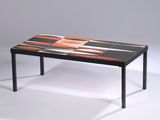 a black table with orange and white designs on it