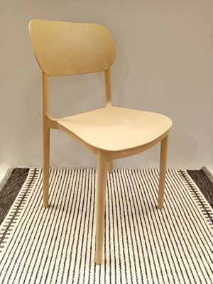 a chair that is sitting on a rug in a room