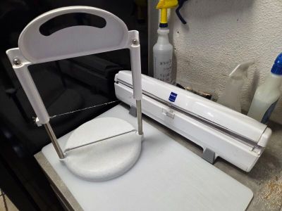 a machine that is sitting on top of a cutting board