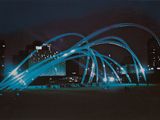 a picture of a city at night with blue lights