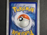 a close up of a pokemon card on a table