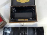 a box with a watch inside of it and a box with a watch inside of it