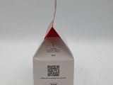 a small white box with a red top on a white surface