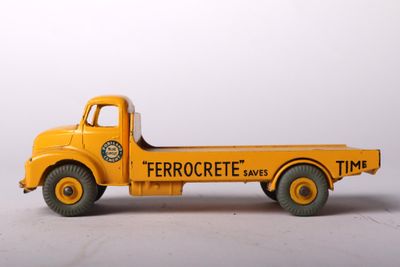 a toy truck that is sitting on a white surface