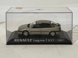 a toy car in a clear box on a white surface