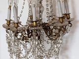 a crystal chandelier hanging from the ceiling