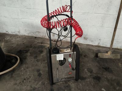 an image of a machine with a hose attached to it