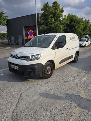 a white van that is parked in a parking lot
