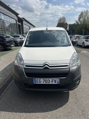 the white van is parked on the side of the road