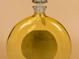 an image of a yellow glass bottle with a silver top