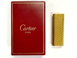 an image of a red box with a gold lighter next to it