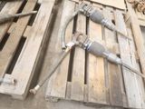 a couple of pipes laying on a pallet next to each other