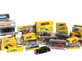many different types of toy cars and trucks on display