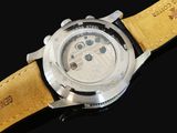 an image of a close up of a watch on a black surface