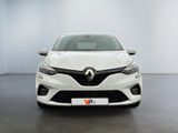 the front view of a white car in a white room