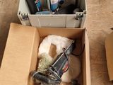 a box of assorted items sitting on the floor