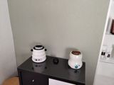 two toasters sitting on top of a black counter