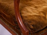 an image of a brown chair with a brown cushion on top of it