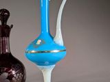 two vases sitting next to each other on a table