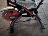 a row of stationary exercise bikes on display in a gym