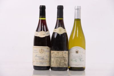 three bottles of wine sitting next to each other on a table