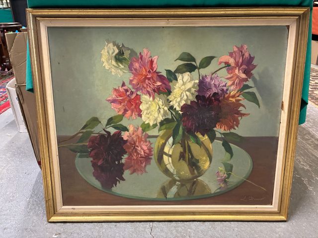 L. DUMET (XXe). Fleurs dans un vase ». Huile sur isorel. Signé en