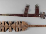 two different types of weapons on display on a table