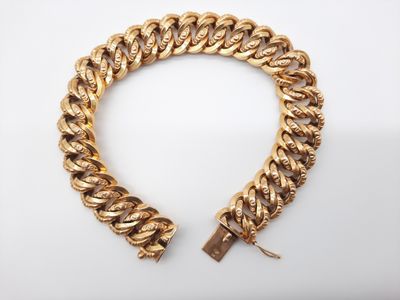 a gold chain bracelet with a lock on a white background