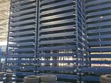 several stacks of tires are stacked on pallets in a warehouse