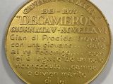a close up of a gold coin with a description on it
